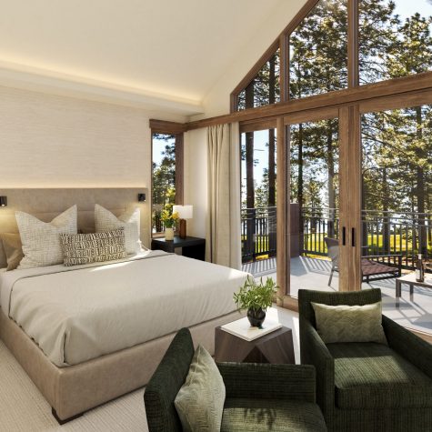 Bedroom interior of The Villa Suites with tall windows and open view.