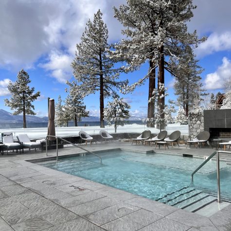 The Edgewood Tahoe Resort's pool deck with snow in the background.